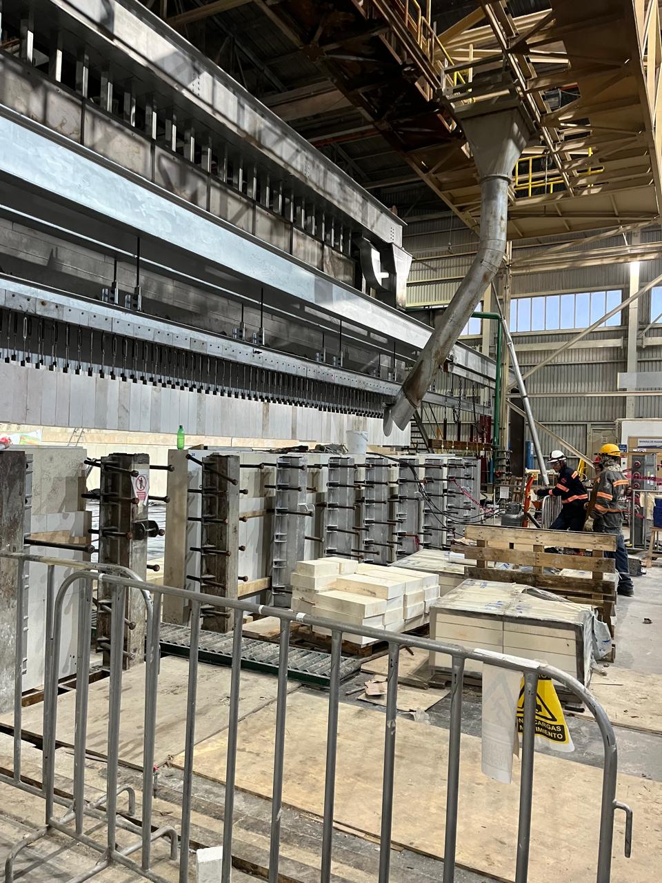 Global Tesca technical personnel working on an industrial production line
